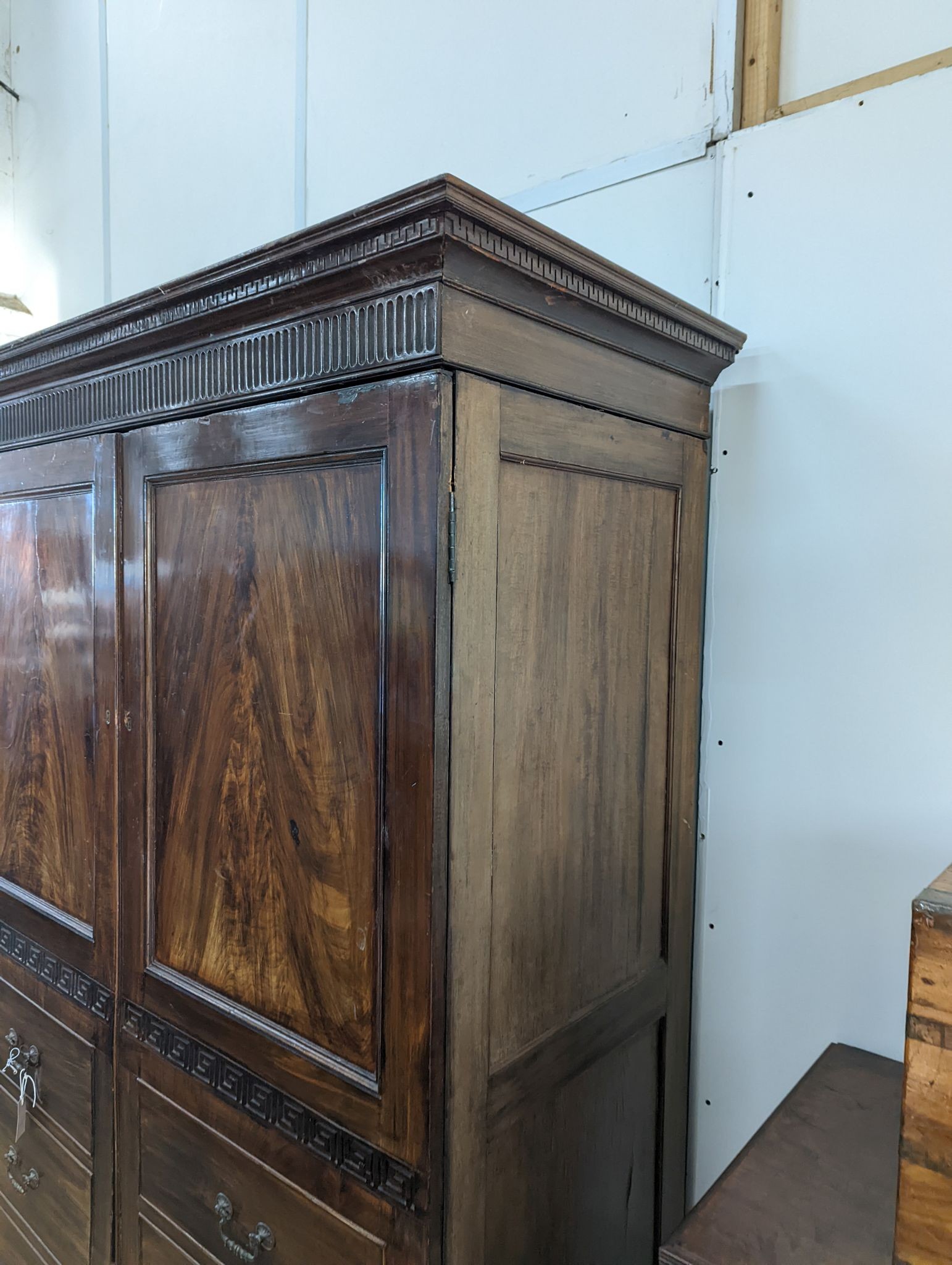 A George IV style mahogany hanging cupboard, width 142cm, depth 65cm, height 209cm